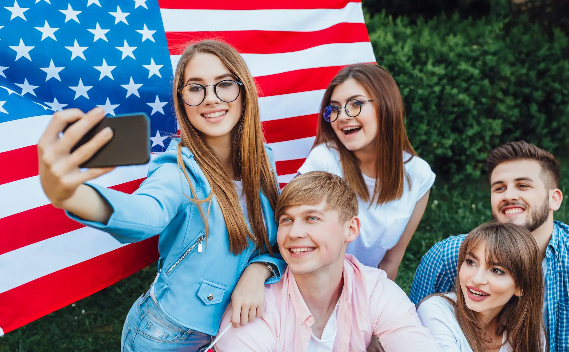 group young americans doing selfie with american flag 1